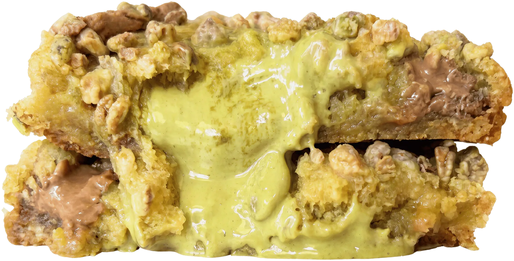 Cookie mi-cuit pistache chocolat au lait ouvert en deux, cœur coulant pistache